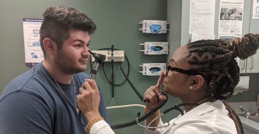 doctor tests patient's eyes